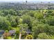 Aerial view of the home showcases its location among mature trees and city views at 2703 Carolyn Se Dr, Smyrna, GA 30080