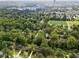 The home's location is visible in this aerial view, with lush greenery and nearby athletic fields at 2703 Carolyn Se Dr, Smyrna, GA 30080