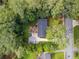 Aerial view of the property featuring a deck, carport, and surrounding trees at 2703 Carolyn Se Dr, Smyrna, GA 30080