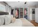 Spacious bedroom with organized closet and plenty of storage for clothes and shoes at 2703 Carolyn Se Dr, Smyrna, GA 30080