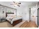 Stylish bedroom features hardwood floors, a ceiling fan, and custom wardrobe storage at 2703 Carolyn Se Dr, Smyrna, GA 30080