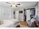 Large bedroom with hardwood floors, built-in closets, ceiling fan, and comfortable seating at 2703 Carolyn Se Dr, Smyrna, GA 30080