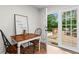 Cozy dining area with wood table and chairs, leading to outdoor deck through glass doors at 2703 Carolyn Se Dr, Smyrna, GA 30080