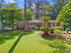 Charming brick home with well-manicured lawn and mature landscaping at 2703 Carolyn Se Dr, Smyrna, GA 30080
