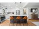 Modern kitchen with white cabinetry, stainless steel appliances, and large center island with bar seating at 2703 Carolyn Se Dr, Smyrna, GA 30080