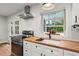 Beautiful kitchen with butcher block countertops, stainless steel appliances, and modern finishes at 2703 Carolyn Se Dr, Smyrna, GA 30080