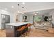 Open-concept kitchen with island seating, stainless appliances, and a view into the living room at 2703 Carolyn Se Dr, Smyrna, GA 30080