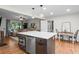 Bright, open kitchen with a large island, stainless steel appliances, and hardwood floors at 2703 Carolyn Se Dr, Smyrna, GA 30080