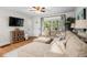 Bright living room showcases stylish furniture, wood floors, and decor accents at 2703 Carolyn Se Dr, Smyrna, GA 30080