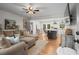 Spacious open-concept living room and kitchen with hardwood floors and stylish decor at 2703 Carolyn Se Dr, Smyrna, GA 30080