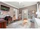 Multi-purpose playroom features exposed brick, a bathroom, and a cozy workspace at 2703 Carolyn Se Dr, Smyrna, GA 30080