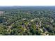 Extensive aerial view of the neighborhood and the mature trees surrounding the properties at 5004 Haralson Sw Way, Lilburn, GA 30047