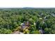 An aerial view of a leafy neighborhood, highlighting the property and surrounding area at 5004 Haralson Sw Way, Lilburn, GA 30047