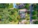 Aerial view of the home featuring the backyard, mature trees, and neighborhood setting at 5004 Haralson Sw Way, Lilburn, GA 30047