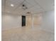 Finished basement area with neutral tile, offering a versatile living or recreational space at 5004 Haralson Sw Way, Lilburn, GA 30047