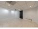 Spacious basement area with projector, perfect for a home theater or entertainment space at 5004 Haralson Sw Way, Lilburn, GA 30047