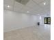 Spacious tiled basement has recessed lighting and ample room for activities at 5004 Haralson Sw Way, Lilburn, GA 30047