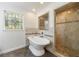 This bathroom boasts a standalone soaking tub and custom shower with upscale fixtures and tiling at 5004 Haralson Sw Way, Lilburn, GA 30047