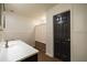 Well-lit bathroom with a vanity, wainscoting, and a shower with curtain at 5004 Haralson Sw Way, Lilburn, GA 30047