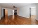 A generous bedroom boasts a ceiling fan, hardwood floors, and multiple entryways, providing an open feel at 5004 Haralson Sw Way, Lilburn, GA 30047