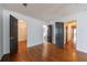 Spacious bedroom with hardwood floors, a closet, and an ensuite bathroom offer comfort and convenience at 5004 Haralson Sw Way, Lilburn, GA 30047
