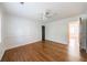 Bedroom showcasing hardwood flooring and neutral walls with a ceiling fan at 5004 Haralson Sw Way, Lilburn, GA 30047