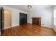 Bedroom featuring hardwood floors, built-in fireplace, and closet at 5004 Haralson Sw Way, Lilburn, GA 30047
