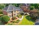 Beautiful brick home boasts manicured landscaping and a inviting walkway at 5004 Haralson Sw Way, Lilburn, GA 30047