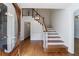 The foyer has a hardwood staircase and floors at 5004 Haralson Sw Way, Lilburn, GA 30047