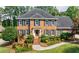 Charming brick home features a well-maintained yard and classic architectural details at 5004 Haralson Sw Way, Lilburn, GA 30047