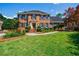 Classic brick residence with a green lawn and meticulously groomed garden at 5004 Haralson Sw Way, Lilburn, GA 30047