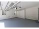 Clean garage with built-in cabinets and shelving for ample storage at 5004 Haralson Sw Way, Lilburn, GA 30047