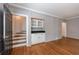 A finished hallway includes hardwood floors, wainscoting, and a wet bar area at 5004 Haralson Sw Way, Lilburn, GA 30047
