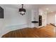 Charming breakfast nook featuring built-in seating, open shelves, and stainless steel oven appliances at 5004 Haralson Sw Way, Lilburn, GA 30047