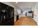 Bright kitchen with stainless steel appliances, granite countertops, and hardwood flooring at 5004 Haralson Sw Way, Lilburn, GA 30047
