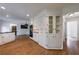 Open kitchen boasts white cabinets, granite countertops, and modern appliances, perfect for cooking at 5004 Haralson Sw Way, Lilburn, GA 30047