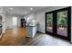 Modern kitchen with stainless steel appliances, granite countertops and access to the backyard deck area at 5004 Haralson Sw Way, Lilburn, GA 30047