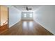 Spacious living room area with hardwood floors and staircase access at 5004 Haralson Sw Way, Lilburn, GA 30047