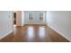Bright and spacious living room with hardwood floors and plantation shutters at 5004 Haralson Sw Way, Lilburn, GA 30047