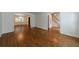 Open-concept living room with hardwood floors and natural light at 5004 Haralson Sw Way, Lilburn, GA 30047