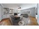 Cozy living room with hardwood floors, built in bookcase, fireplace, and neutral furniture at 5004 Haralson Sw Way, Lilburn, GA 30047