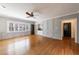 Bright living room with beautiful hardwood floors, paneled walls, and large windows at 5004 Haralson Sw Way, Lilburn, GA 30047