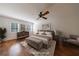 Bright main bedroom with a ceiling fan, and large windows at 5004 Haralson Sw Way, Lilburn, GA 30047