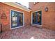 Brick patio space with access to the house, offering an inviting outdoor space at 5004 Haralson Sw Way, Lilburn, GA 30047