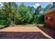 Brick patio on the back of the home at 5004 Haralson Sw Way, Lilburn, GA 30047