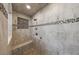 Custom walk-in shower with glass enclosure features tiled walls, built-in bench, and niche for storage at 5004 Haralson Sw Way, Lilburn, GA 30047