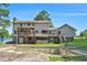 Back exterior view with deck, screened porch, and in-ground pool at 5419 Ahyoka Dr, Morrow, GA 30260