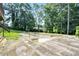 Large, in-ground pool in overgrown backyard at 5419 Ahyoka Dr, Morrow, GA 30260