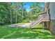 Spacious backyard with wooden deck and empty in-ground pool at 5419 Ahyoka Dr, Morrow, GA 30260