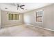 Bedroom with a ceiling fan and natural light from two windows at 5419 Ahyoka Dr, Morrow, GA 30260